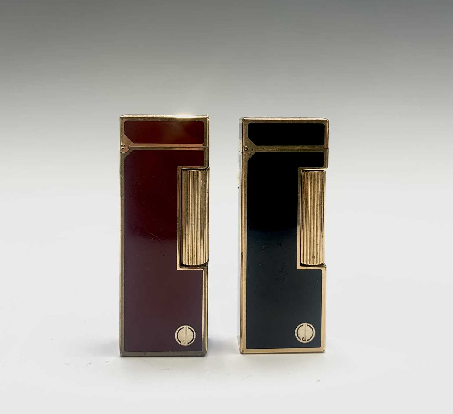 Lot 71 - Two Dunhill gold plated Rollagas lighters,