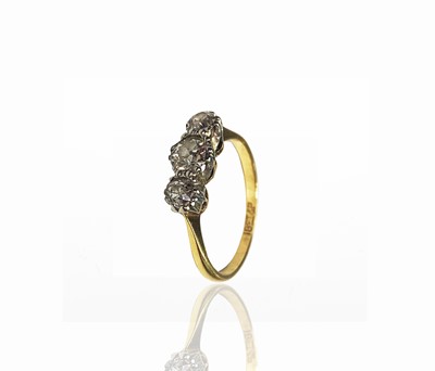 Lot 82 - An 18ct gold ring set with three bright...