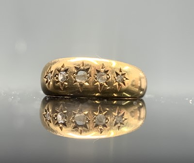 Lot 408 - An 18ct gold ring gipsy set with five diamonds...