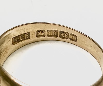 Lot 408 - An 18ct gold ring gipsy set with five diamonds...