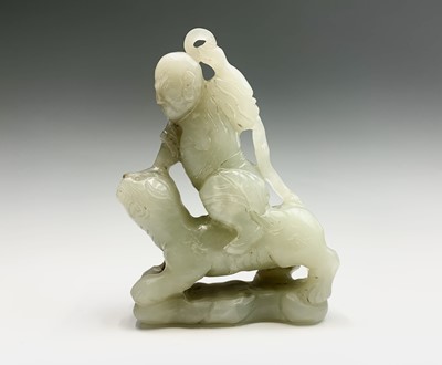 Lot 47 - A Chinese jade carving of a diminutive figure,...