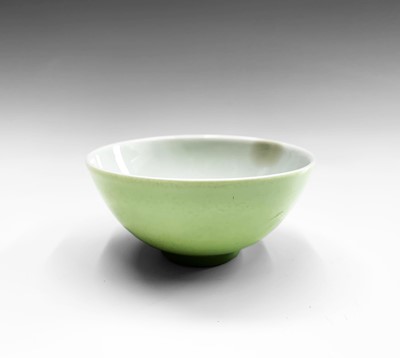 Lot 252 - A Chinese lime-green monochrome porcelain wine...