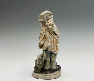 Lot 1061 - A Norman Underhill pottery figure modelled as...