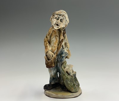 Lot 1061 - A Norman Underhill pottery figure modelled as...