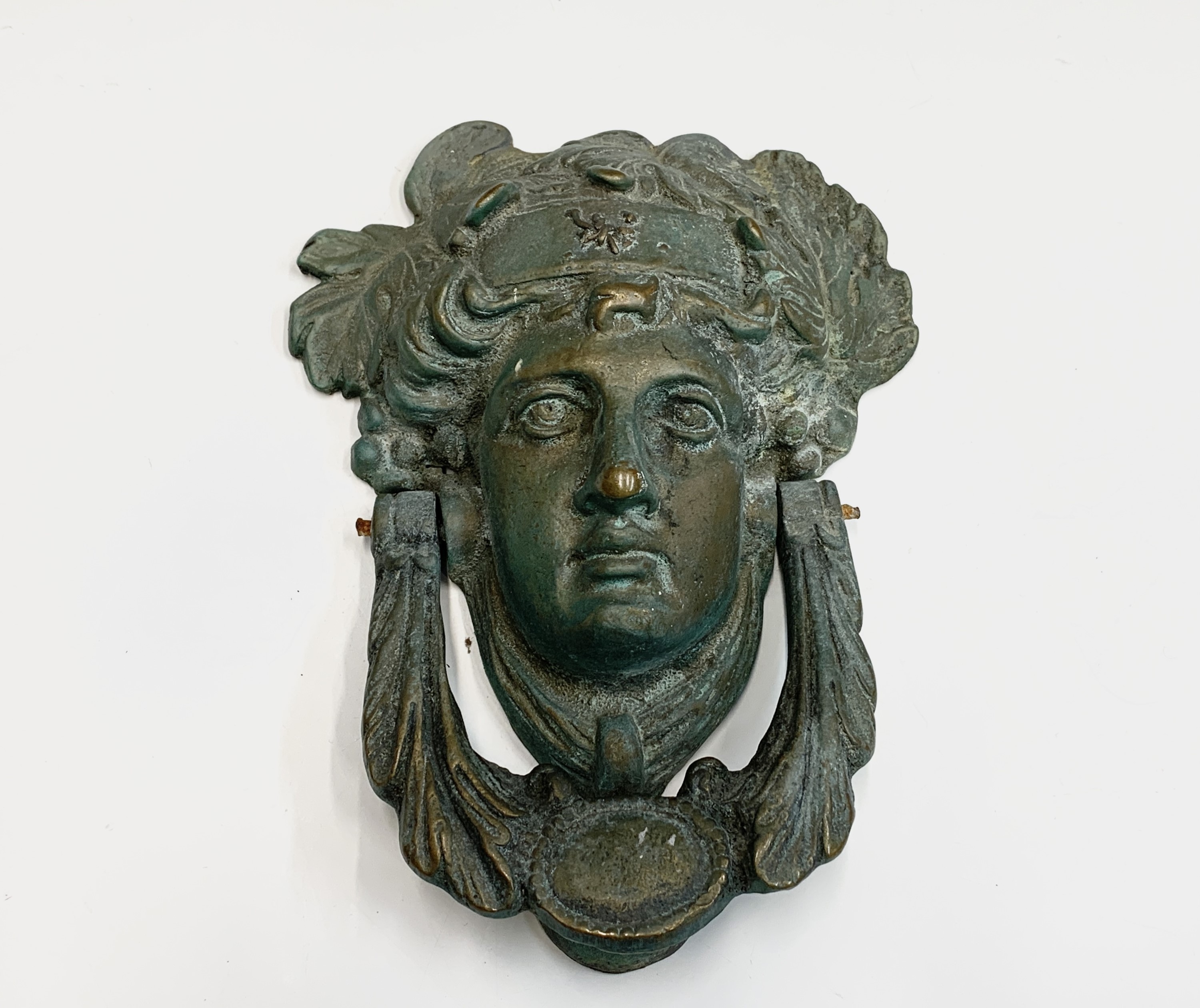 Lot 356 - A bronze door knocker, cast as the head of