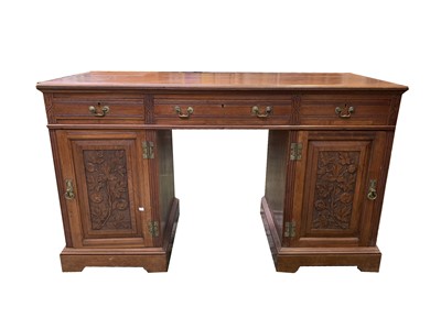 Lot 3216 - A Victorian walnut twin pedestal desk, the...