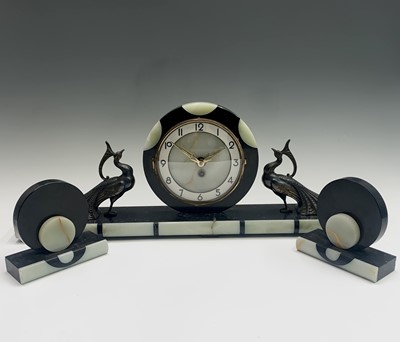 Lot 2928 - A French Art Deco three piece clock garniture,...