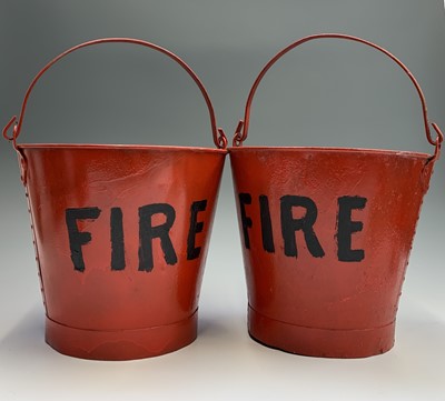 Lot 353 - A pair of red painted 'FIRE' buckets. Height...