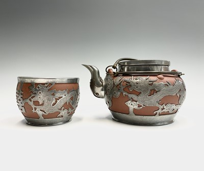 Lot 240 - A Chinese Yixing pottery teapot and sugar bowl,...