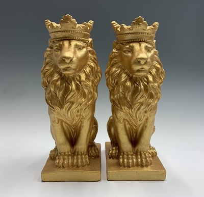 Lot 351 - A pair of gold painted seated lions with...