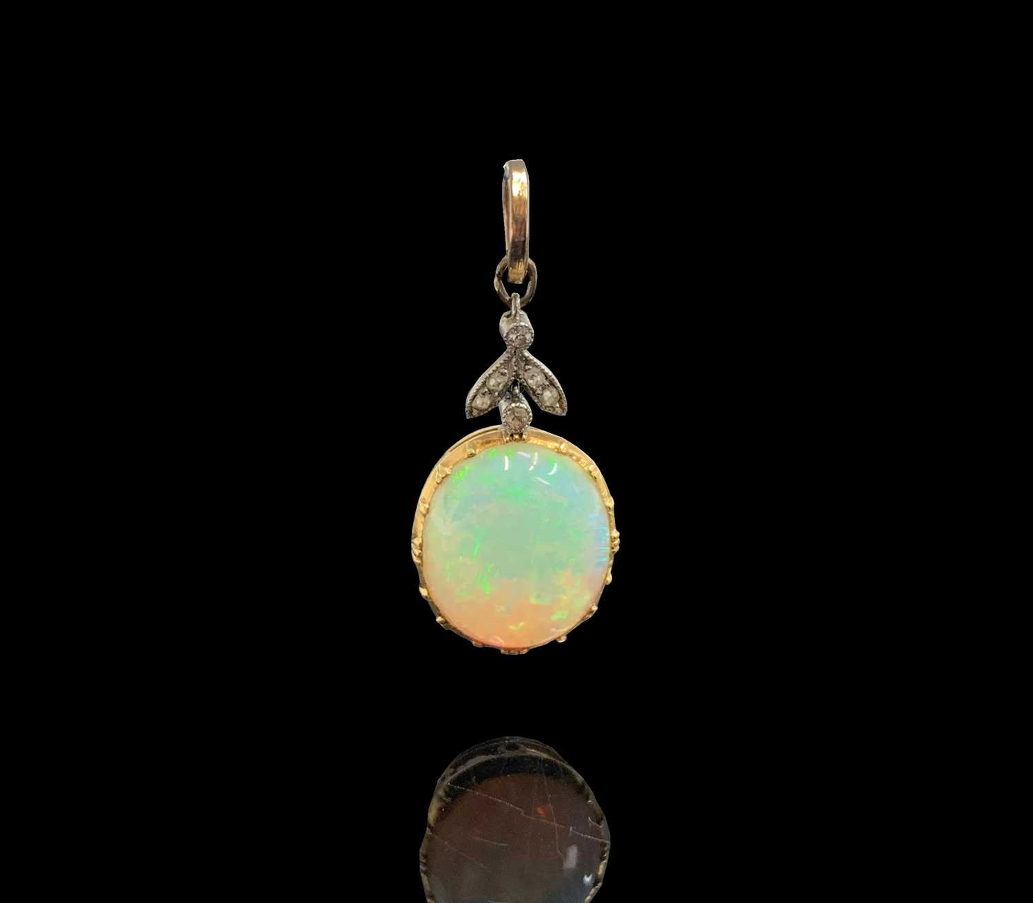 Lot 226 - An Edwardian gold-mounted opal pendant, it...