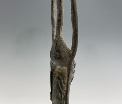 Lot 363 - An African bronze figure of elongated form,...