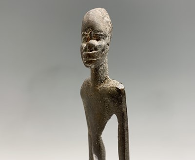 Lot 363 - An African bronze figure of elongated form,...