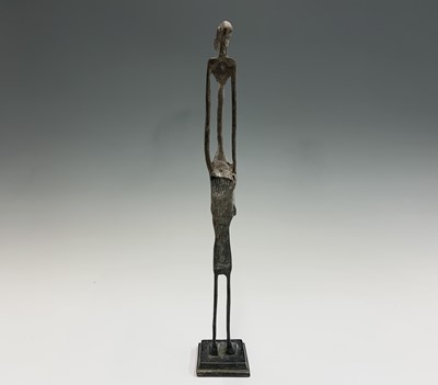 Lot 363 - An African bronze figure of elongated form,...