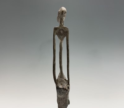 Lot 363 - An African bronze figure of elongated form,...