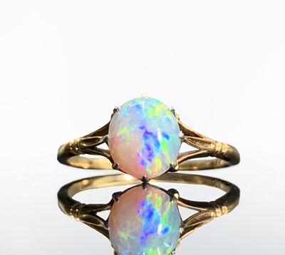 Lot 301 - An 18ct gold opal set ring with elegant...