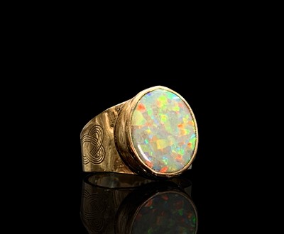 Lot 306 - A 9ct gold opal ring with collet setting and...