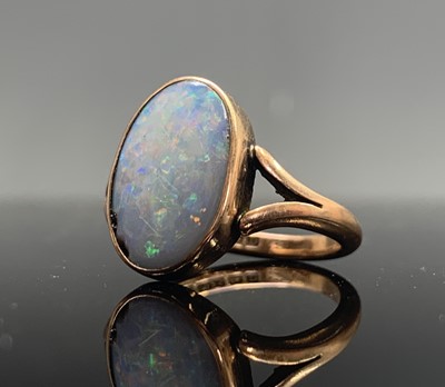 Lot 39 - Three gold rings each set an oval opal 8.5gm