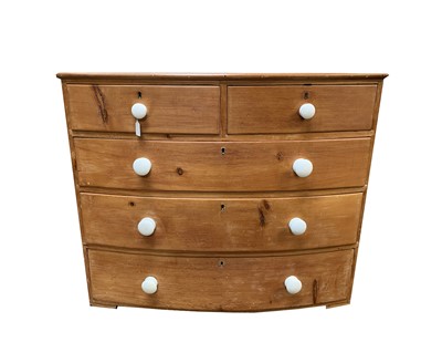 Lot 3224 - A 19th century pine bow front chest of two...