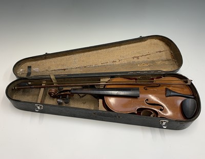 Lot 355 - A violin, length of back 14.25", with bow, cased.