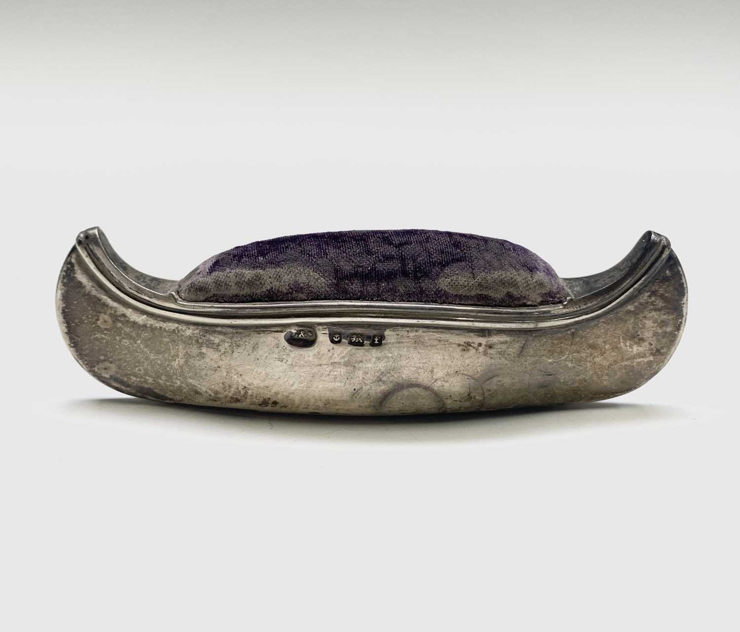 Lot 1011 - An Edwardian silver canoe pincushion by Levi &...