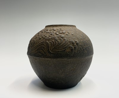 Lot 276 - A Japanese cast iron spherical pot, with wave...