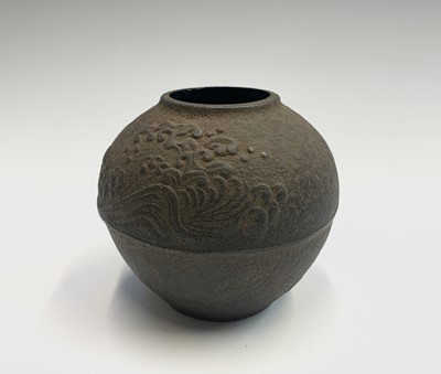 Lot 276 - A Japanese cast iron spherical pot, with wave...