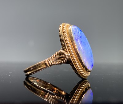 Lot 29 - A 14ct gold ring set with an opal in...
