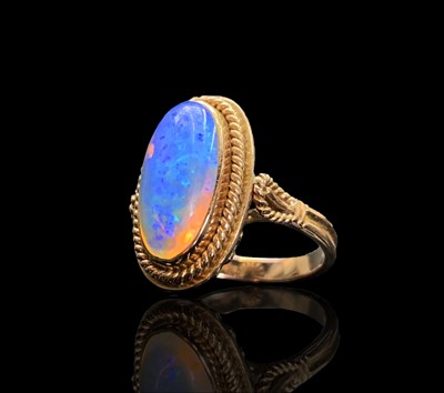 Lot 29 - A 14ct gold ring set with an opal in...