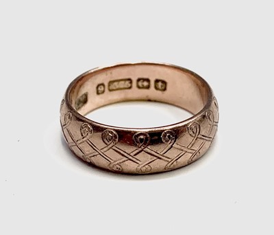 Lot 398 - A 9ct rose gold engraved band Birmingham 1918...