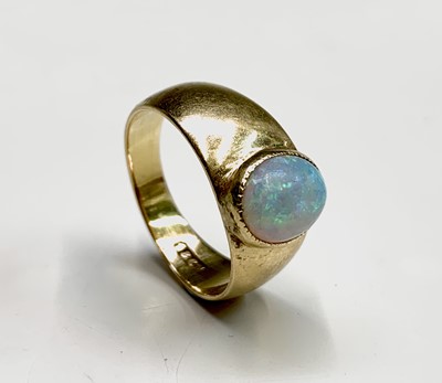Lot 317 - An 18ct gold ring collet set with an opal...