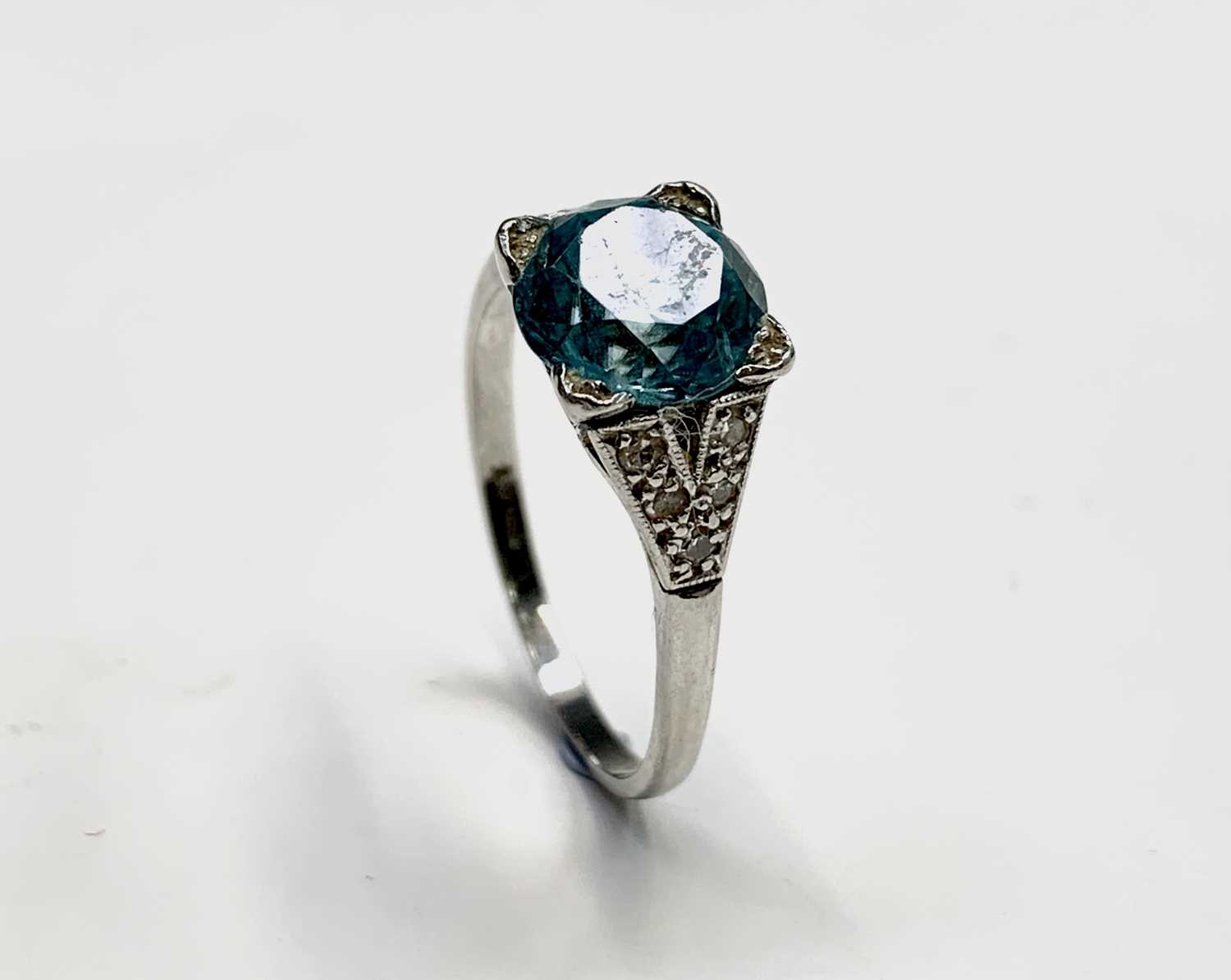 Lot 150 - A platinum ring set an aquamarine of...