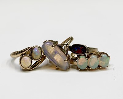 Lot 378 - Four gold rings set with opals 16.6gm