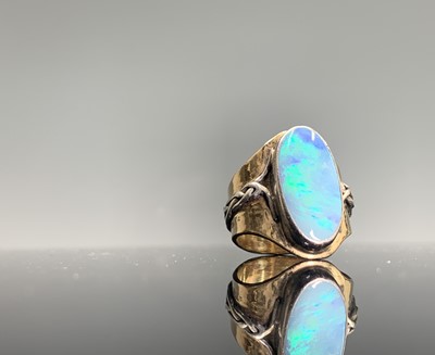 Lot 48 - A craft gold and silver ring set an opal 12.6gm