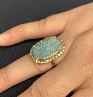 Lot 204 - An impressive 18ct (unmarked) gold oval opal...