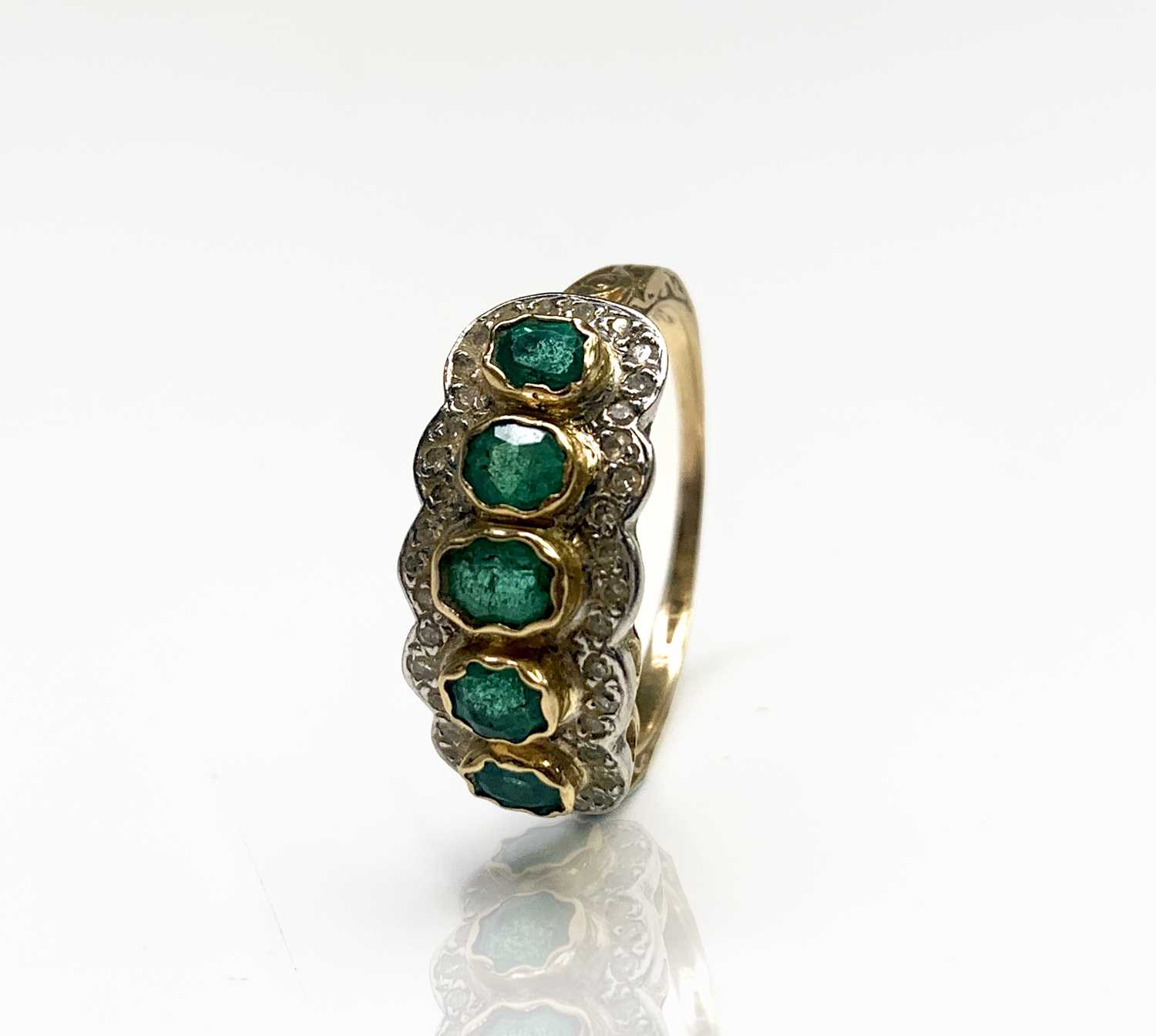 Lot 244 - An 18ct gold emerald and diamond quintuple...