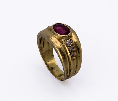 Lot 128 - An 18ct broad ruby-set ring with diamond line...