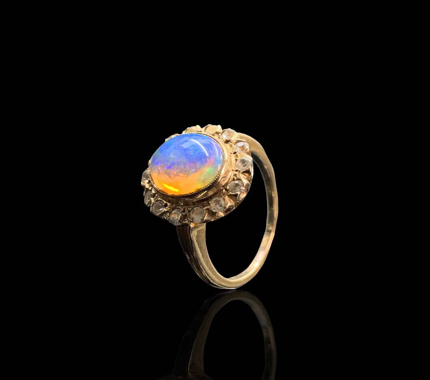 Lot 183 - An opal and white stone cluster 10ct gold ring...
