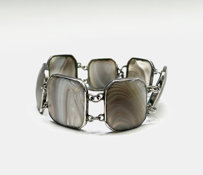 Lot 412 - A silver bracelet with 7 panels of grey/white...