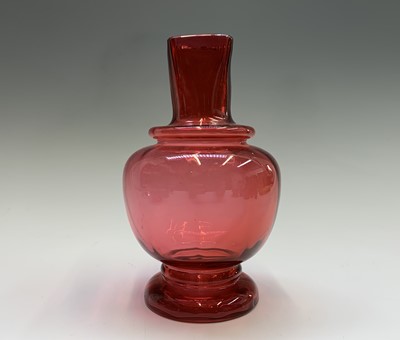 Lot 1116 - A Victorian ruby glass lustre vase, with two...