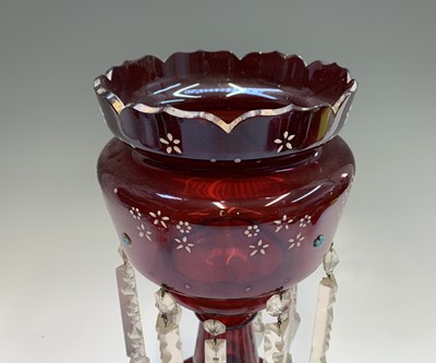 Lot 1116 - A Victorian ruby glass lustre vase, with two...