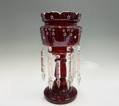 Lot 1116 - A Victorian ruby glass lustre vase, with two...