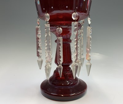 Lot 1116 - A Victorian ruby glass lustre vase, with two...