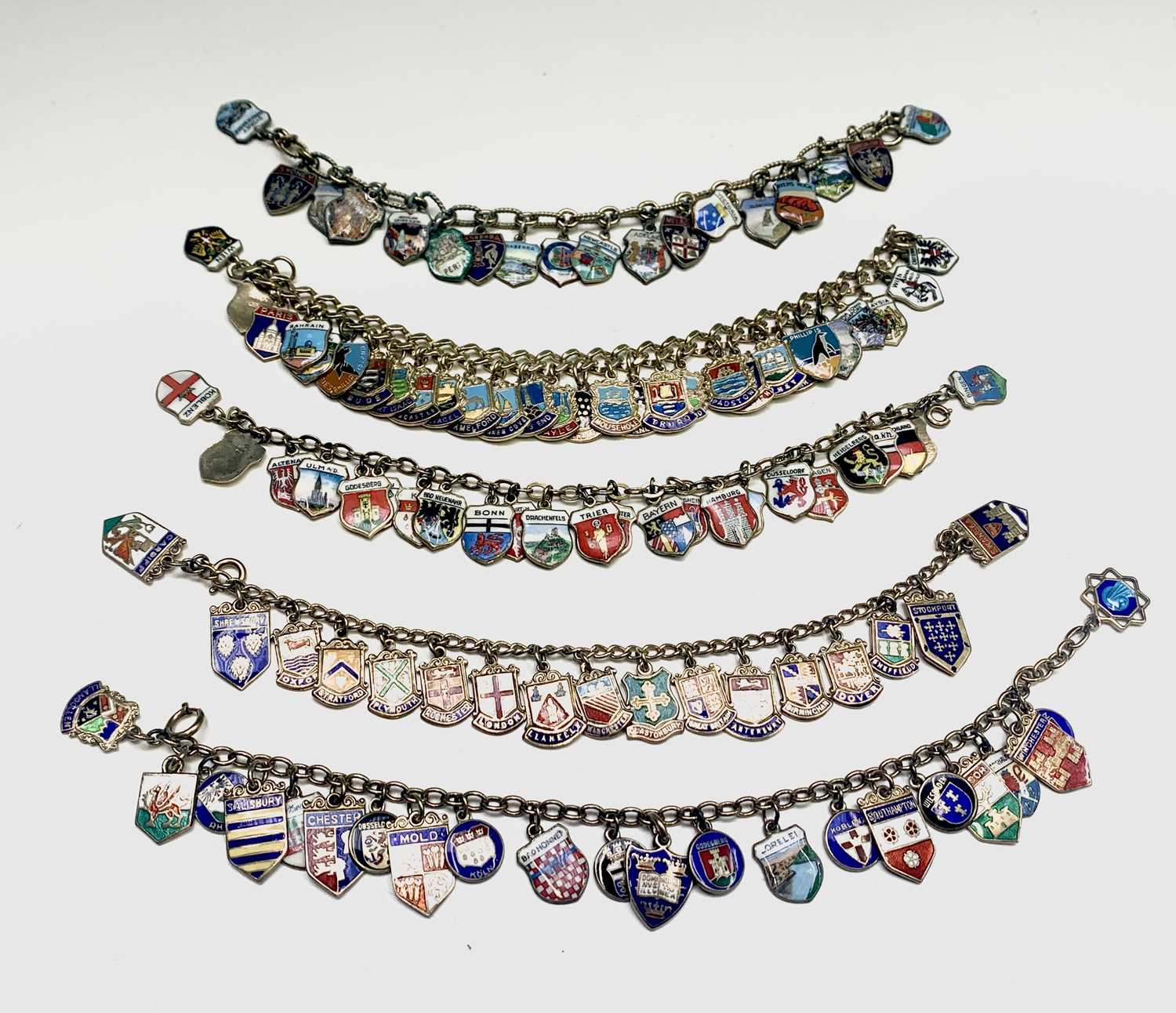 Lot 136 - Five chain bracelets each filled with a mass...