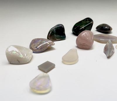 Lot 410 - Polished unmounted opals 102gm