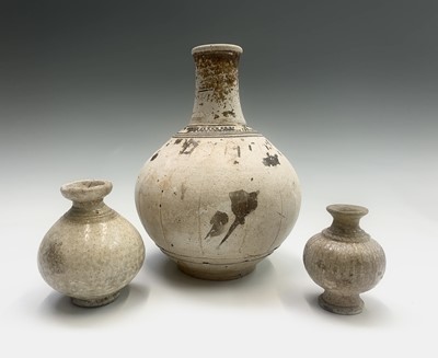 Lot 300 - Three early Cambodian khmer vases, height of...