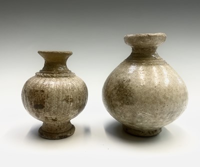 Lot 300 - Three early Cambodian khmer vases, height of...