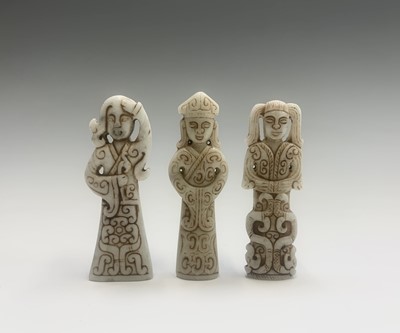 Lot 301 - Three Chinese carved greenstone figures, of...