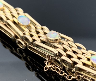 Lot 152 - A 9ct gold four-bar gate-link bracelet mounted...
