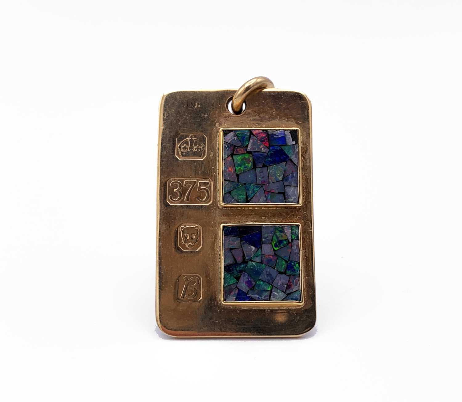Lot 4 - A 9ct gold ingot pendant mounted with two opal...